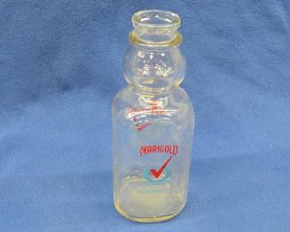 Lot 252. Vintage one-Quart glass milk bottle from the Marigold Dairy