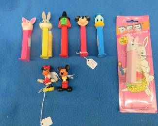 Lot 140. Mickey and Minnie Mouse figurines plus 6 Pez dispensers