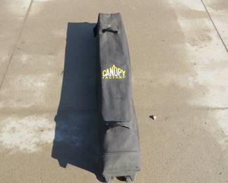 Lot 27. 10' x 10' Canopy Factory canopy with case, one leg locking pin doesn't work perfectly
