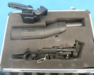 Lot 86. Bushnell 18 x 36 spotting scope.  Includes strap, tripod, window mount, and a case.