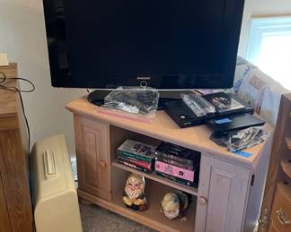 3 items: TV stand. 30" Samsung tv w/remote. Blu-ray player.