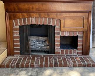Electric fireplace with heater and lighted logs.