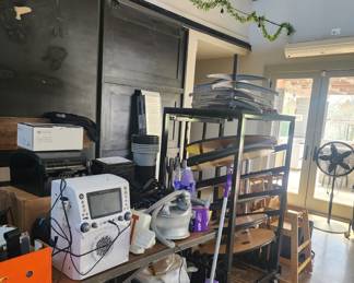 Various commercial and household cleaning supplies as well as this amazing karaoke machine