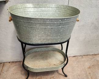 Metal cooler/serving tub and stand; all it needs is ice and beverages!