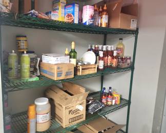 Various cases, flats and singles of various sauces, dips, jams, coffees, and condiments