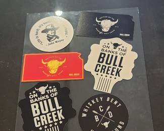 Bull Creek Distillery advertising including large and small signage, menus, and promotional items