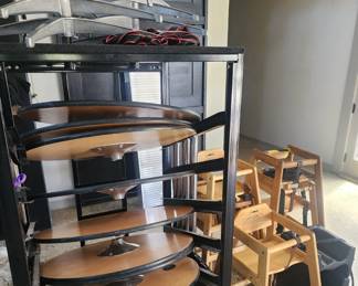 Round high top tables and storage rack, high chairs and booster seats