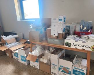 Multiple boxes of Monogram brand (and others) restaurant style take out containers, plasticware, paper products including handled bags