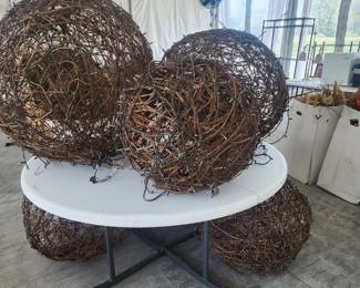 5' round white plastic tables and large round woven decor for ground or hanging