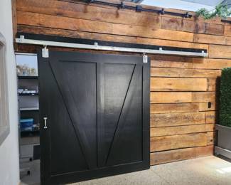 Solid wood double barn door with frame and track