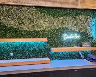 Additional foliage backdrop, shelving, cabinetry and signage (check out that adorable Drunk in Love sign)