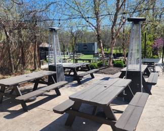 Large wooden picnic tables and heaters!