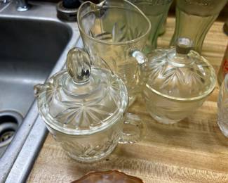 Multiple Sets of Creamer, Sugar, and Butter Dishes