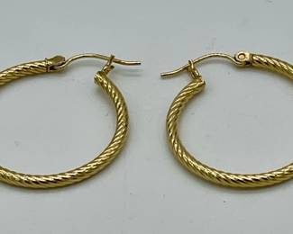 14K yellow gold hoop earrings.