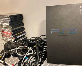 PS2 game system with 2 remotes, 2 microphones and 17 games.