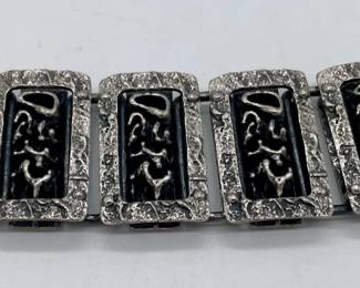 Brutalist silver metal link bracelet.