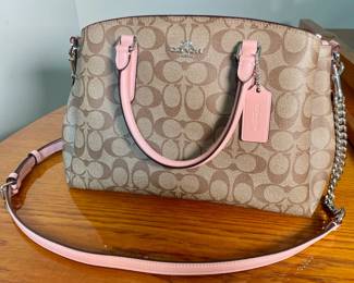 Coach signature “C” pink handle handbag.