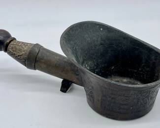 Chinese bronze ladle with archaic designs and carved wood handle.