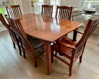 Dining table with one leaf and 6 chairs.