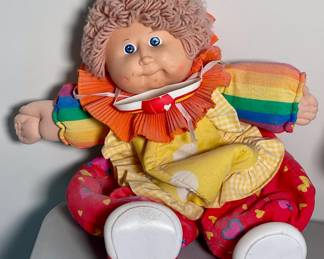 1986 Cabbage Patch Kid with pink tag and clown outfit.