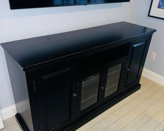 PRICE:$450.00 ETHAN ALLEN BLACK DISTRESSED MEDIA CABINET
WITH GLASS DOORS
62”L x 18.5”D x 34”H 