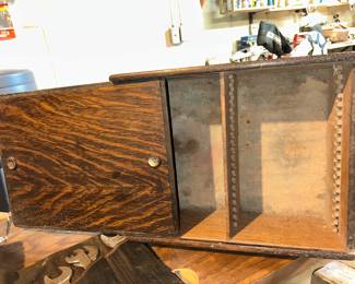 This is a National Cash Register filing case with a sliding door. Information is provided by NCR on the back of the sliding door,  