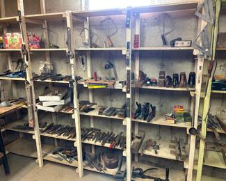 Lots of tools, including various vintage wood working planes, 