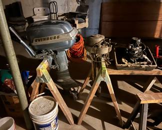 Evinrude Elto very old boat motor on the right and on the left is an earlier 1950s 15 hp Evinrude boat motor.