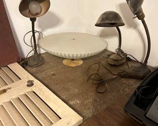 Art Deco gooseneck lamps in the dining room overhead light.