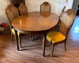 dinning room table, 6 mesh back/cushion seat chairs (only showing 5 in the picture)  Note the 'china' cabinet in the back ground. 