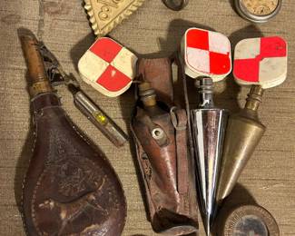 On top, we have a 40\80 from world war one, Marbles Arms long stem lapel brass compass, plumb bobs,