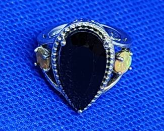 STERLING SILVER RING WITH FACETED SAPPHIRE CENTER STONE