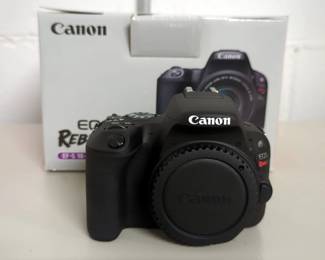Canon Rebel SL2 EOS 200D Camera Body With EF-S18-55mm f/4-5.6 IS STM Lens, Strap, Battery Charger, And Battery Pack
