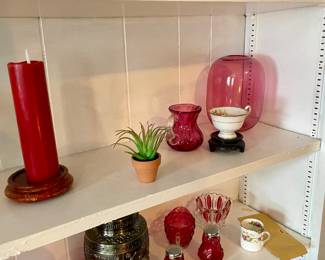 Large assortment of cranberry glass