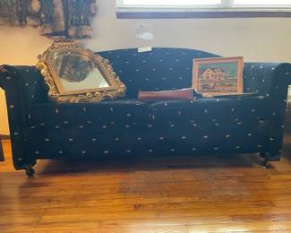 Navy Sleeper Sofa, Gold framed mirrors, Charles Wysocki Print Framed Tray, Decorative Stone Embedded Wall Hanging, Vintage Purse