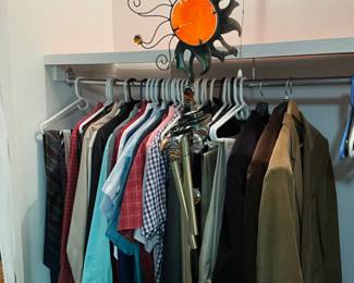 Bedroom - closet - men’s clothing, metal sun hanging 