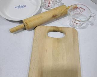 Corningware pieplate, Pyrex measuring cups, rolling pin, cutting board.