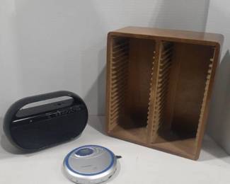 GPX radio (no cord, but works has batteries), portable CD player and wooden CD holder. 13 x 11 x 5
