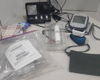 Miscellaneous health items. Blood pressure machine, peak flow meter, oxygen level machine, face masks, small volume nebulizer and phone ring signaler