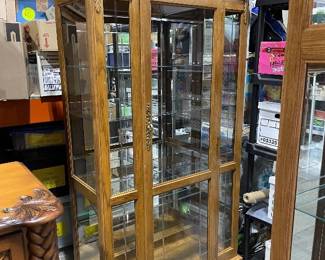 Carved top oak and glass curio cabinet 80 x 40 x 18 in