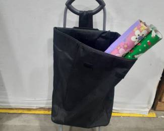 Rolling bag with wrapping paper. 36 inches tall