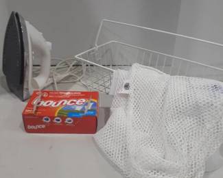 Miscellaneous laundry items. Dryer sheets, ironing board, wire basket Sunbeam iron and laundry bags