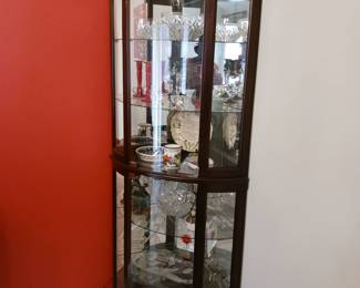 One of two Corner curio cabinets