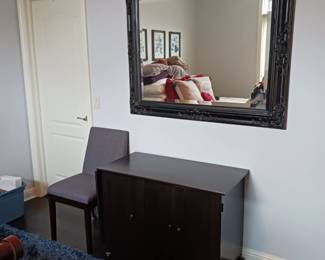Large black framed mirror