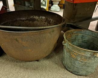 Much rustic cast iron and metal. Cast iron kettle w/ handle and meal buckets 