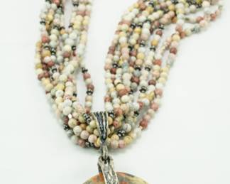 Multi-strand beaded necklace with turtle & stone pendant