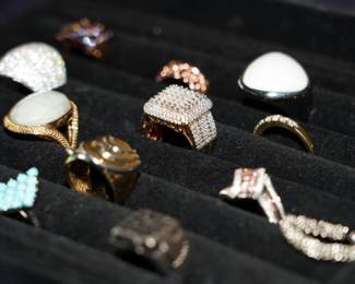There are approximately 100 rings available for sale; with different gemstones, in different materials, with unique settings. 