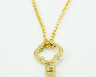 Gold tone key pendant with chain