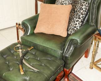 Super cool retro green tufted leather armchair with ottoman; an of course a vintage dagger. 