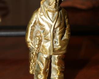 Brass fisherman sculpture
